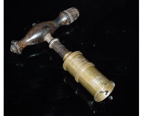 A Victorian brass cylindrical corkscrew by Robert Jones & Son No 2, the plain cylinder with raised banded decoration and insc