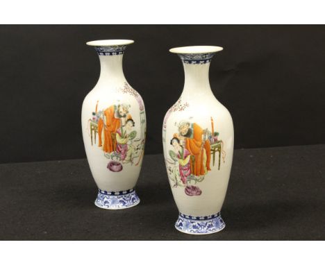 A pair of Chinese polychrome decorated vases, the main bodies decorated with figures in an interior, a bearded man looking ov