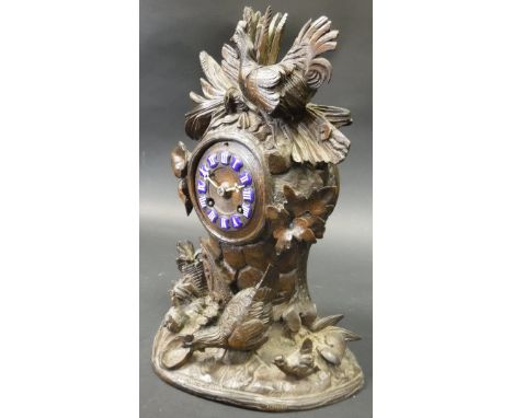 A 19th Century Black Forest type carved cased mantle clock, decorated in high relief with cockerel, chicken and chicks, the 8