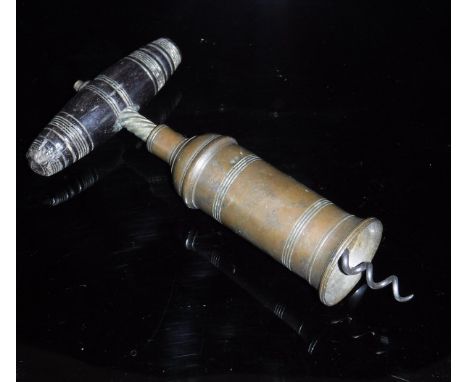A 19th Century brass corkscrew, the cylinder with ringed decoration and domed shoulders, enclosing a single twist action and 