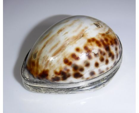 A late 18th/early 19th Century cowrie shell and silver (unmarked) mounted snuff box, the lid with engraved decoration and ins
