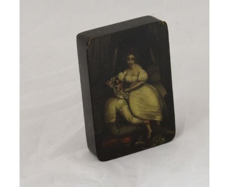 A circa 1800 German lacquered papier maché snuff box by Stobwasser, the lid decorated with a couple in a bedroom scene, inscr