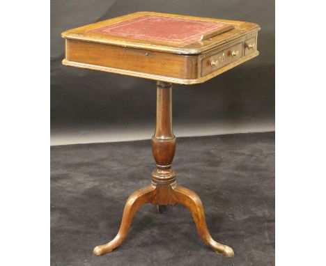 An early 19th Century mahogany reading table, the adjustable slope top with tooled and gilded leather writing surface over tw