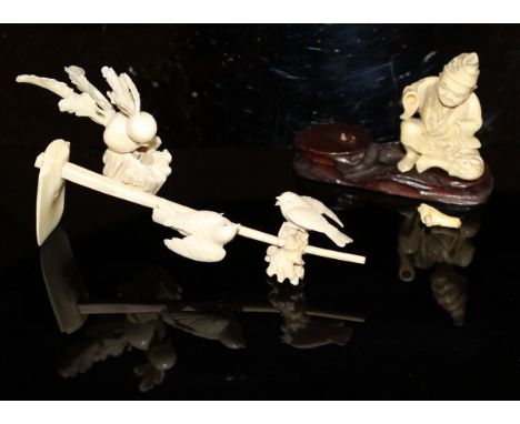 A 19th Century Chinese carved ivory figure group as two birds seated upon the handle of an adze with radishes, 15 cm long, to