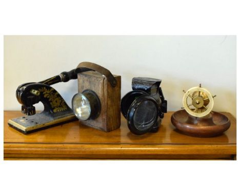 Late Victorian letter punch, together with two vintage hand lamps and a novelty nutcracker with ships-wheel handle (4)  