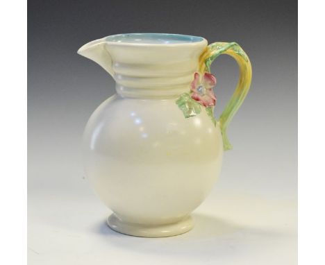 Clarice Cliff for Newport Pottery Company bulbous jug having relief moulded floral handle, brown back stamp and raised 'Clari
