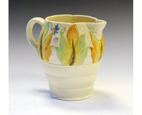 Clarice Cliff for Newport Potter Company bulbous jug having relief moulded foliate and floral decoration with brown back stam