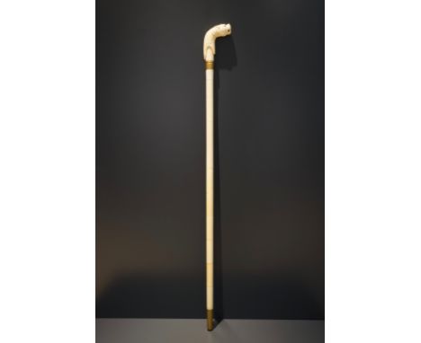 An Anglo-Indian ivory and brass walking stick or cane with a lion's head, 19th C. L: 93 cm Condition reports and high resolut