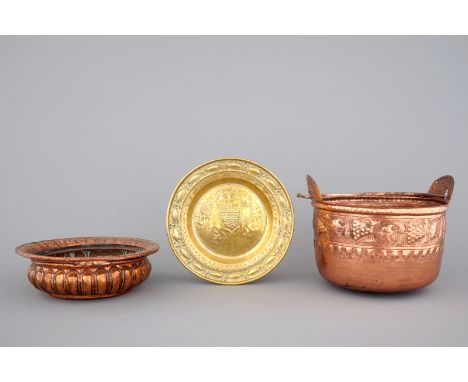 A Flemish brass alms dish, an Italian brass basin and a French brass kettle, all 17th C. Dia: 35 cm (the largest)Generally in