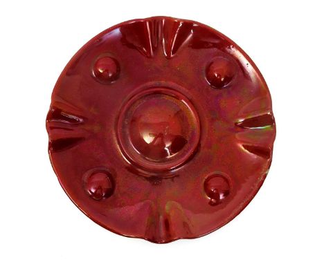 A Carter's Poole Pottery small wall charger designed by Owen Carter or James Radley Young,  with fluted rim, modelled in reli