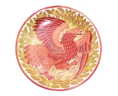 A William De Morgan shallow dish by Charles Passenger, painted with an eagle stretching its wings before a fruiting tree, in 