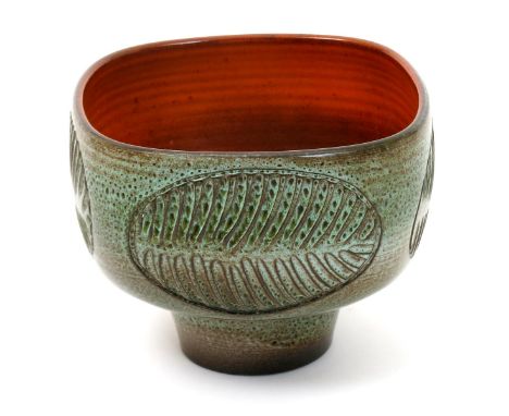 A Poole Pottery Atlantis vase by Guy Sydenham,  footed square section, incised with panels of stylised leaf motif, spray glaz