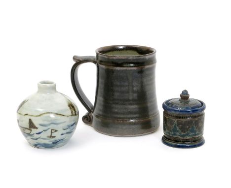 Leach Pottery a stoneware mug, with applied scroll handle, covered in a tenmoku glaze, a Leach Pottery vase by Trevor Corser 