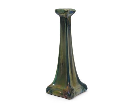 A Carter & Company Poole Pottery lustre candlestick designed by Owen Carter, tapering square section, covered in a streaked g