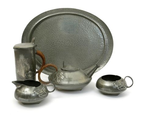 A Liberty & Co English Pewter  four piece tea set designed by Archibald Knox,  model no.0231, cast in low relief with Art Nou