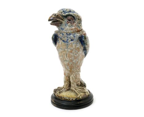 A Martin Brothers stoneware bird jar and cover by Robert Wallace Martin, dated 1904, modelled standing, forward facing with b