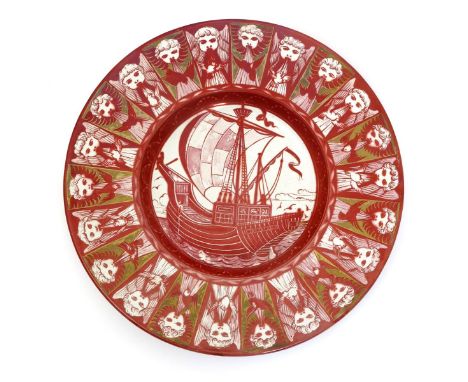 A rare William De Morgan Galleon charger, painted to the well with a galleon at full sail, the border with a frieze of cherub