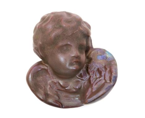 A rare Carter's Poole Cherub paperweight,  covered in a red lustre glaze, impressed Carter's Poole mark 11cm. wide