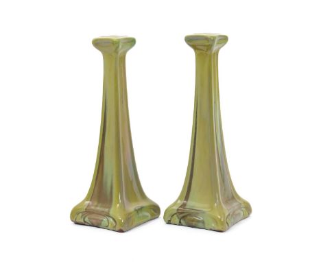 A pair of Carter's Poole lustre tall candlesticks designed by Owen Carter, dated 1906,  tapering square section with flaring 