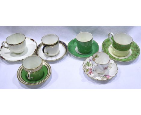 Six George Jones coffee cans and saucers, slight wear to gilt on some cans but otherwise good, no chips or cracks. P&amp;P Gr