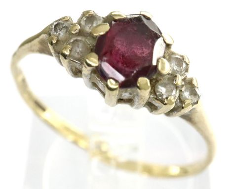 9ct gold ring set with a central ruby and diamond shoulders, size O, 1.2g. P&amp;P Group 1 (£14+VAT for the first lot and £1+