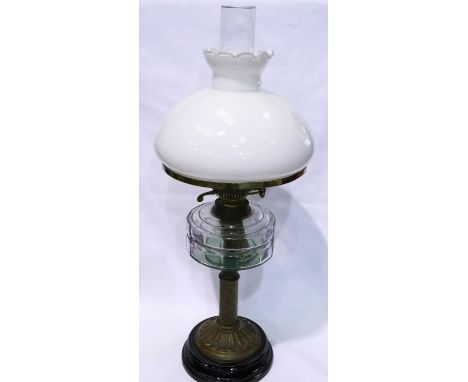 Brass mounted paraffin lamp on a wooden base, H: 67 cm. Not available for in-house P&amp;P 