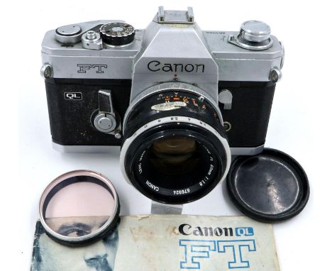 Canon FT 35mm SLR camera body with Canon 1:1.8 FL lens and instruction manual. P&amp;P Group 1 (£14+VAT for the first lot and