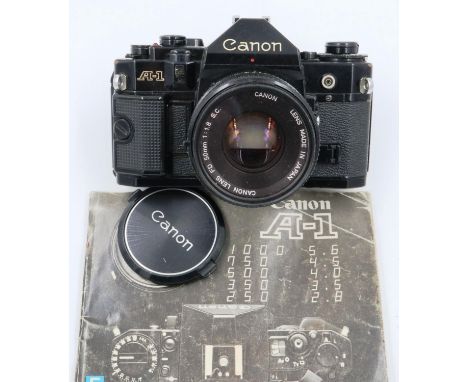 Canon A-1 35mm SLR camera body with Canon 1:18 SC lens and instruction manual. P&amp;P Group 1 (£14+VAT for the first lot and