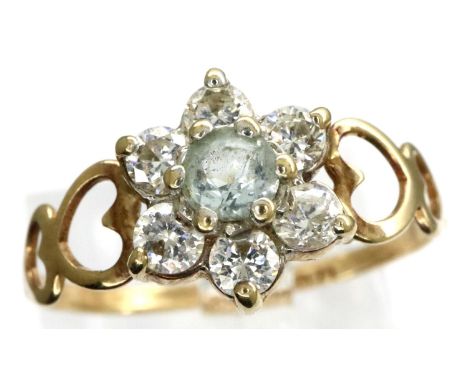 9ct gold flower ring set with CZ stones, size P, 1.1g with pierced heart shoulders. P&amp;P Group 1 (£14+VAT for the first lo