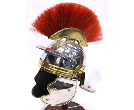 Model Roman Legionnaires helmet on stand, H: 20 cm. P&amp;P Group 3 (£25+VAT for the first lot and £5+VAT for subsequent lots