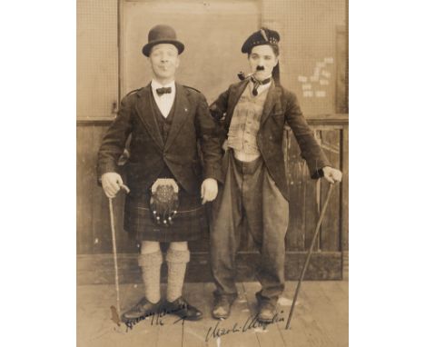 Chaplin (Sir Charles, "Charlie", film actor and director, 1889-1977) and Sir Harry Lauder (Scottish singer and comedian, 1870