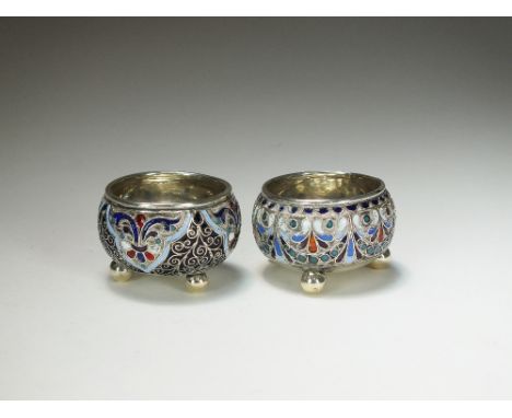 A near pair of Russian cloisonne enamel silver salts, each of cauldron form with blue, red, white, green and black enamel dec