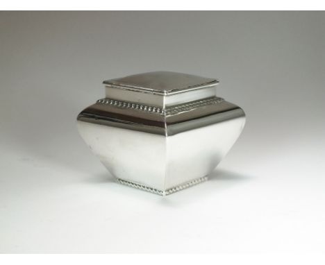 A small silver tea caddy, T.L, London 1898, of tapered square form with rope twist rim to base and top, the hinged cover open