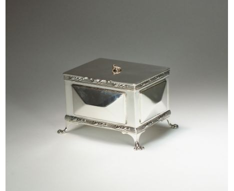 An Edwardian silver ink well casket, Hukin & Heath, London 1904, the silver box of rectangular form with panelled sides, the 