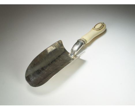 A Victorian silver presentation trowel, Walker & Hall, Birmingham 1872, the curved blade with engraved inscription and acorn 