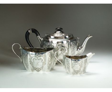 A Victorian three piece silver tea service, Martin Hall & Co, Sheffield 1899, each piece of oval shaped form with engraved an