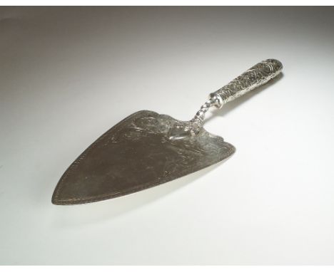 A Victorian silver presentation trowel, George Adams for Chawner & Co, London 1863, the blade with engraved foliate decoratio