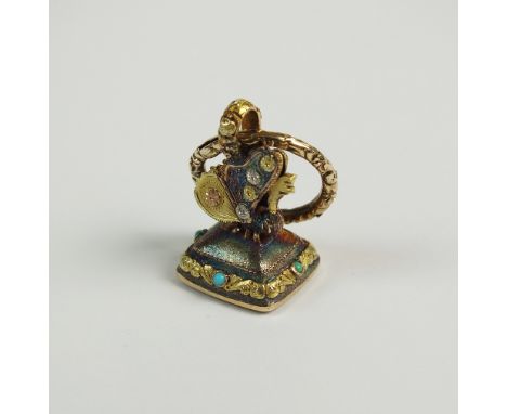 An early 19th century agate seal with butterfly mount, the white agate intaglio seal set within yellow metal scrolling collar