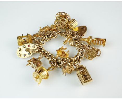 A 9ct gold curb link bracelet with attached 9ct gold charms, to include; an artists easel, a ship in a bottle, a phone box an