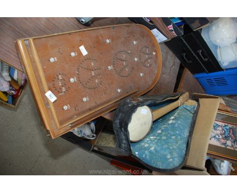 A small banjo with case, a/f. and a Bagatelle board.