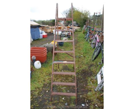A 7 rung wooden step ladder.