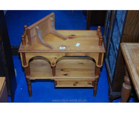 Modern pine display unit with drawer and wall bracket.