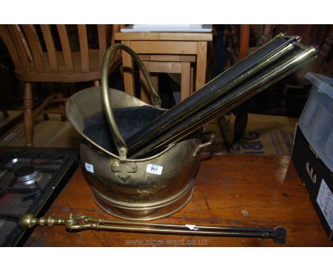 Brass helmet shaped coal scuttle, tongs and fireguard