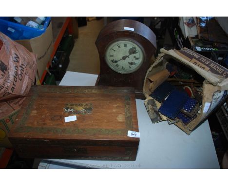 A quantity of well worn Meccano, a mantle clock and a brass inlaid box.