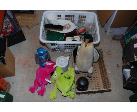 A basket of casserole dish, china, oil lamp and cuddly toys etc.