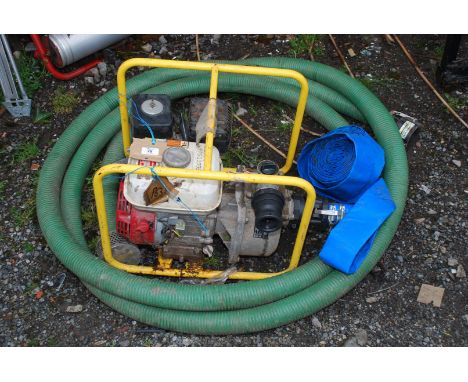 A Honda GX120 engine and water pump complete with suction &amp; delivery hoses. Understood to be in working order.