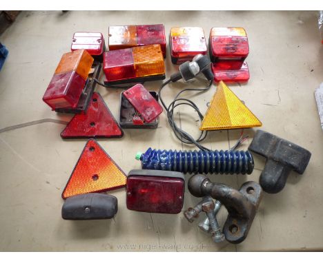 A quantity of trailer/vehicle rear lamps, a pair of trailer side-marker side lamps, a cartridge of grease, a number plate lam