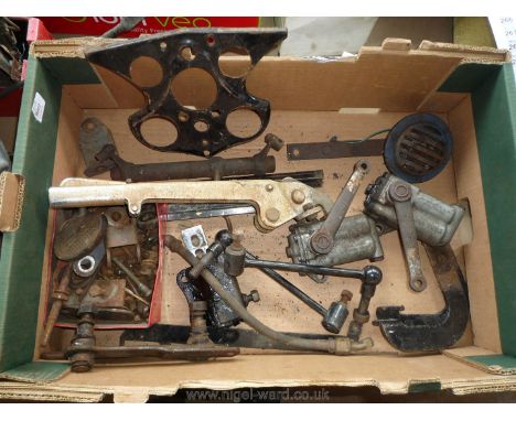 A quantity of Morris 8 spares including a hand brake lever, bumper brackets, a pair of lever- arm shock absorbers/dampers, a 