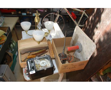 A three branch light fitting, tools, oil cans, hand tools, a clock, etc.,