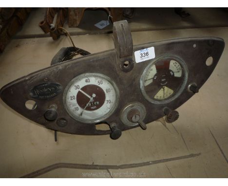 An old Bakelite Morris Eight Series E dash Panel with Smiths instruments including 0-75 mph speedometer (1600 turns per mile)